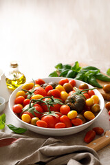 Fresh ripe cherry tomatoes and large red tomatoes