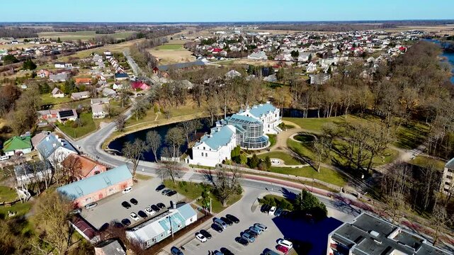 Kretinga museum with winter garden in Kretinga manor park in Samogitia, Lithuania. Aerial drone 4K video footage