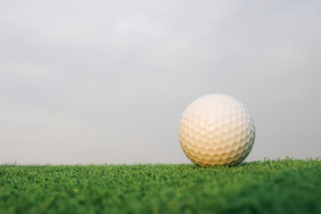 Close-Up of a White Golf Ball on a Fresh Green Grass Surface