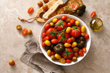 Fresh ripe cherry tomatoes and large red tomatoes, top view