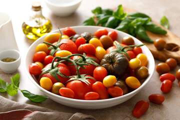 Fresh ripe cherry tomatoes and large red tomatoes