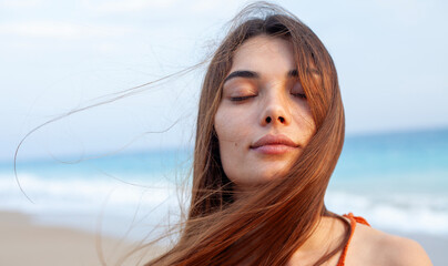young woman relaxing at the beach
