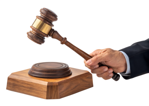 Hand holding wooden gavel striking sound block in law court