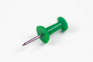 Close-up of a colored pin on a white background, isolate with space for text