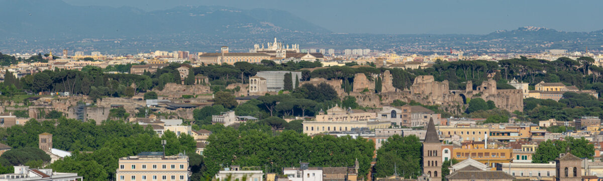 Panoramic view from the Janiculum with the ancient ruins of the Palatine and the green cityscape with the hills in the distance, Rome, Italy