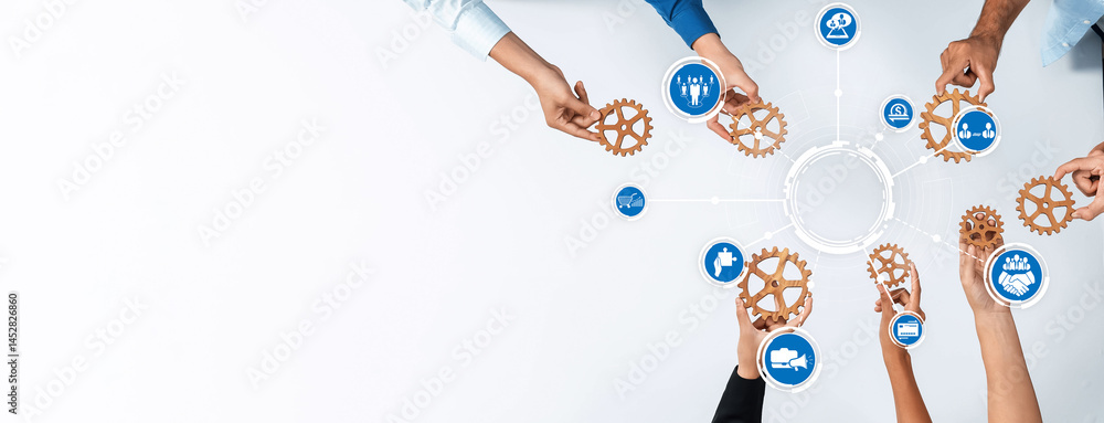 Leinwandbilder a dynamic overhead view of diverse hands engaging with gears, symbolizing teamwork and collaboration