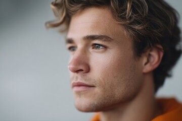 Fototapeta premium portrait of person in prison attire against blurred background offering contemplative expression