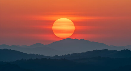 Breathtaking Sunset Over Mountain Range with Vibrant Orange Sky