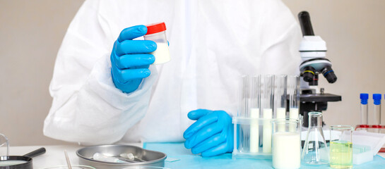 Fototapeta premium Examine milk in the laboratory. Selective focus.