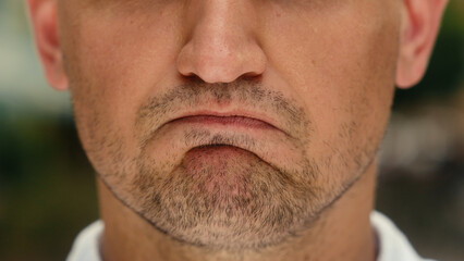 Obraz premium Lower face part close up mouth guy Caucasian man lips stressed emotion angry irritated annoyed male businessman tourist outdoors negative expression mad furious facial anger problem nervous in city