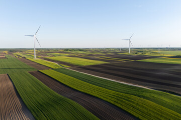 Aerial view of wind turbines on an agricultural field. Sustainable energy