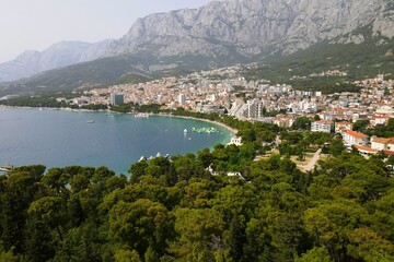 Obraz premium Makarska, Croatia. Coastal town, sea and mountains, Biokovo park. Aerial photography from a drone. Croatian town