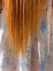 Long ginger hair and dress.