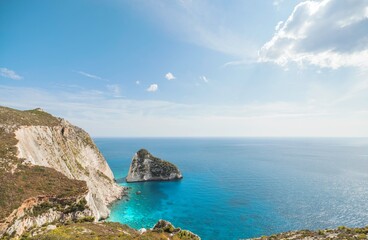 Fototapeta premium Vibrant landscapes showcase the stunning cliffs, crystal-clear waters, and enriching culture of Zakynthos, inviting travelers to discover its beauty under the summer sun