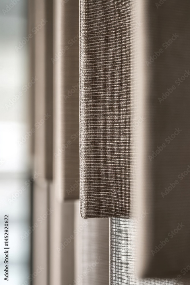 Poster close up of modern beige fabric blinds creating a textured pattern with soft light and shadow minima