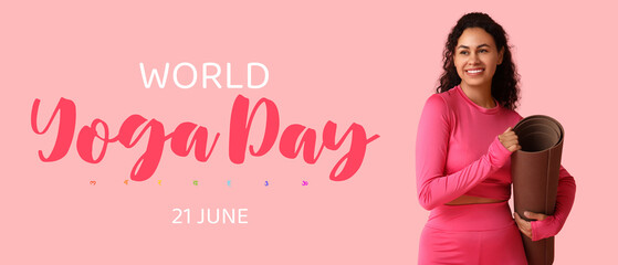 Sporty young African-American woman with yoga mat on pink background