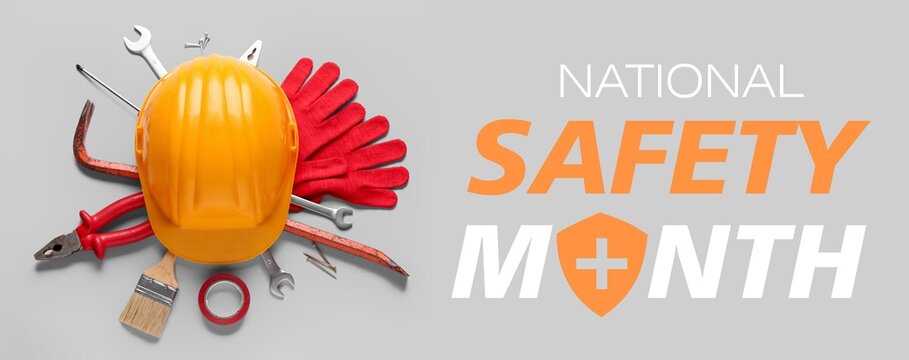Hardhat and tools on grey background. Banner for National Safety Month