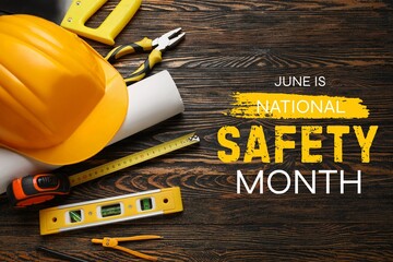 Hardhat and tools on wooden background. Poster for National Safety Month