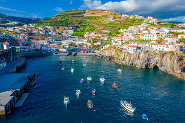 Aerial drone view of Camara de Lobos village panorama near to Funchal, Madeira. Small fisherman...