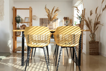 Interior of modern studio apartment with dining table