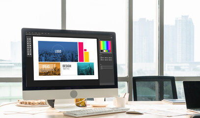Graphic designer software for modern design of web page and commercial ads showing on the computer...