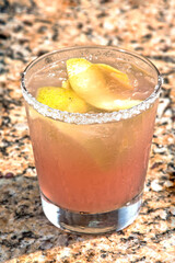 Guava margarita cocktail in a salt-rimmed glass, refreshing tropical drink, traditional cocktail