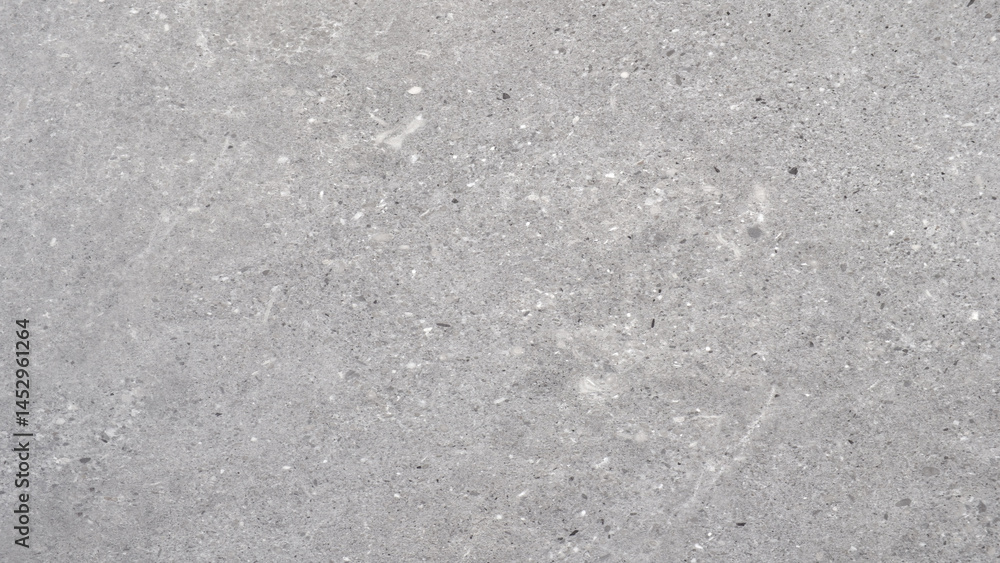 Fototapete A grey background with a few black dots scattered around. dots are placed in various sizes and positions, creating a sense of depth and texture. overall effect is a somewhat chaotic.