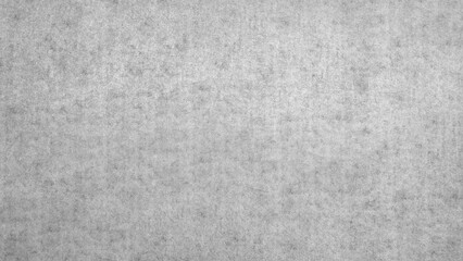 A grey background with a few black dots scattered around. dots are placed in various sizes and positions, creating a sense of depth and texture. overall effect is a somewhat chaotic.