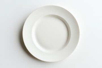 A single white ceramic plate centered on a white surface top