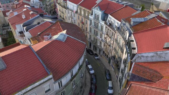 Curvy Street in Lisbon with Azulejo Fascades. Aerial Shot of Traditional Portuguese Houses decorated with Ceramic Tiles