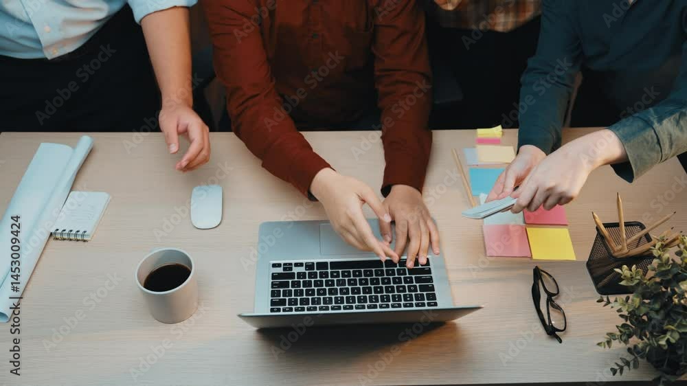 Aufkleber a diverse group of professionals collaborates around a table in a modern office, engaged in planning