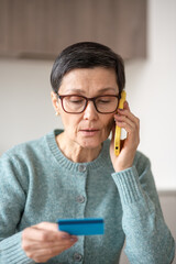 Trusting mature woman dictates card number, expiration date and CVV to criminals. Full financial...