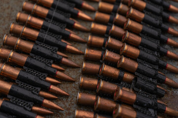 brass cartridges in a machine gun belt