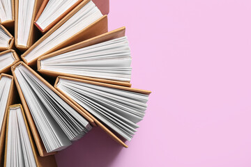 Composition with books on lilac background, closeup