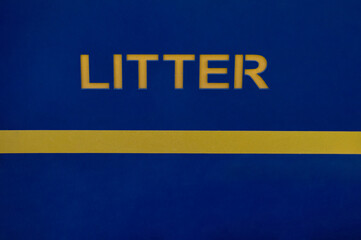 Naklejka premium yellow litter sign on the dark blue background. Think green concept, litter symbol.