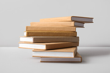 Stack of books on grey background
