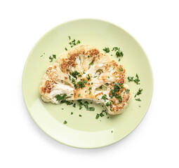 Plate with grilled cauliflower steak and parsley on white background