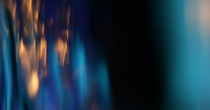 Abstract light leaks on black background with copy space. Studio lens flare bokeh effect. 4k video