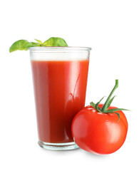 Glass of fresh tomato juice with basil on white background