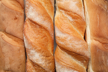 Texture of fresh baguettes on white background, closeup