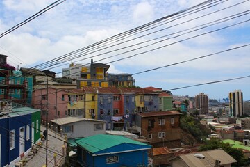 Panoramic view of Valpara&iacute;so, Chile, showcasing its iconic colorful houses, winding streets, vibrant street art, and hillside neighborhoods,an artistic and historic coastal city full of charm