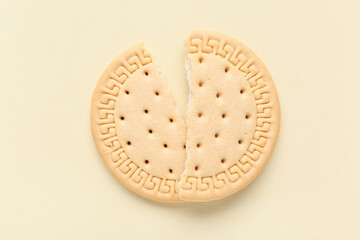 Broken sweet cookie on yellow background