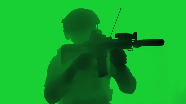  Infrared night vision thermal view of a tactical soldier in combat gear aiming a rifle indoors during a covert operation.