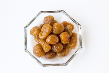 Traditional Turkish Candied Chestnuts designed in glass plate on white surface