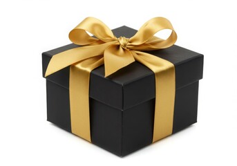 A black gift box with a gold ribbon and bow on a white background view isolated on white background