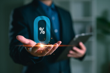 Businessman hand holding 0% hologram, representing zero interest, promotion, financial offer, loan deal, or marketing campaign in modern digital economy.