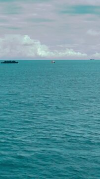 Scenic Ocean View from a Ship with Boats in Motion