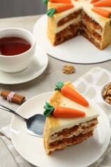 Delicious homemade carrot cake served on light grey table