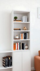 white book shelf with books and a chair