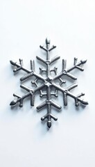Intricate silver snowflake, isolated on white , abstract, frozen, graphic